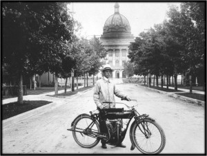 photo of E.L. Luther - 1st Extension agent hired in 1912 on his two-cylinder motorbike