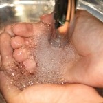 a person washing her hands