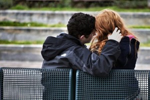 photo of a boy and girl on a bench