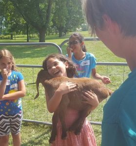 Participants at Cloverbud Day Camp enjoyed playing with the goats from Cristo Rey Ranch.