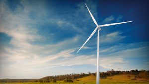 Wind turbine standing in field