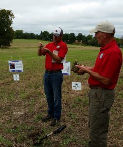 2 speakers in red shirts and the healthy soil- healthy water presentation
