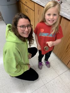 Members of Calumet 4-H Club showing the ornaments they made for residents of a nursing home